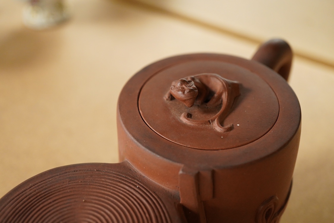 A Chinese Yixing conjoined teapot and cover, 21cm wide